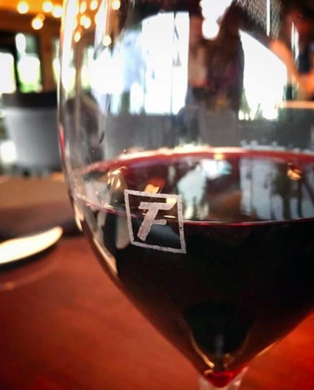 A glass of red wine served at Happy Hour at Fleming's Steakhouse in Rancho Mirage, California 