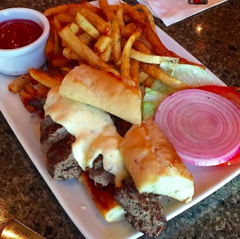A steak sandwich served during Happy Hour at Ruth Chris Palm Desert