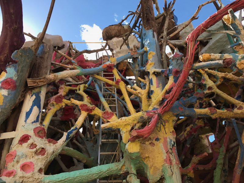 A big mess of limbs, ladders, and ropes at Salvation Mountain 