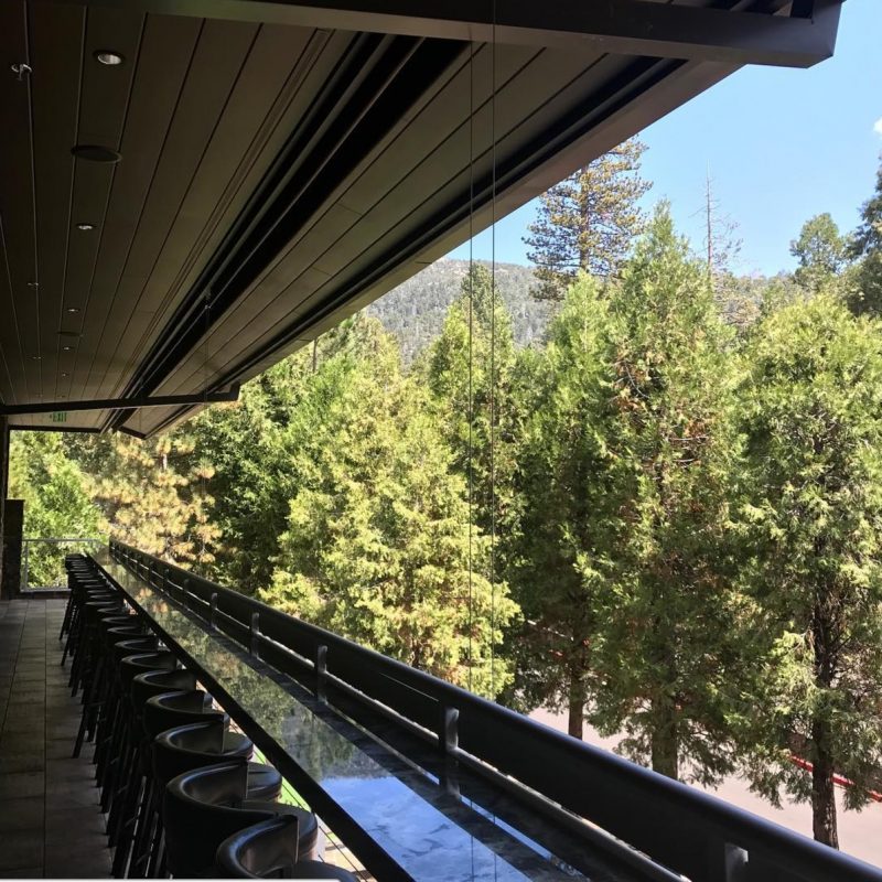 The patio at Idyllwild Brewpub looks out over tons of trees
