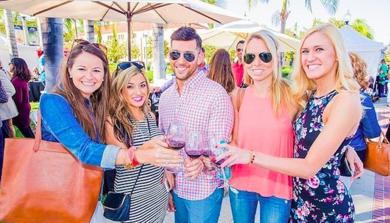 VinDiego attendees enjoy sampling wine with their discount tickets in San Diego