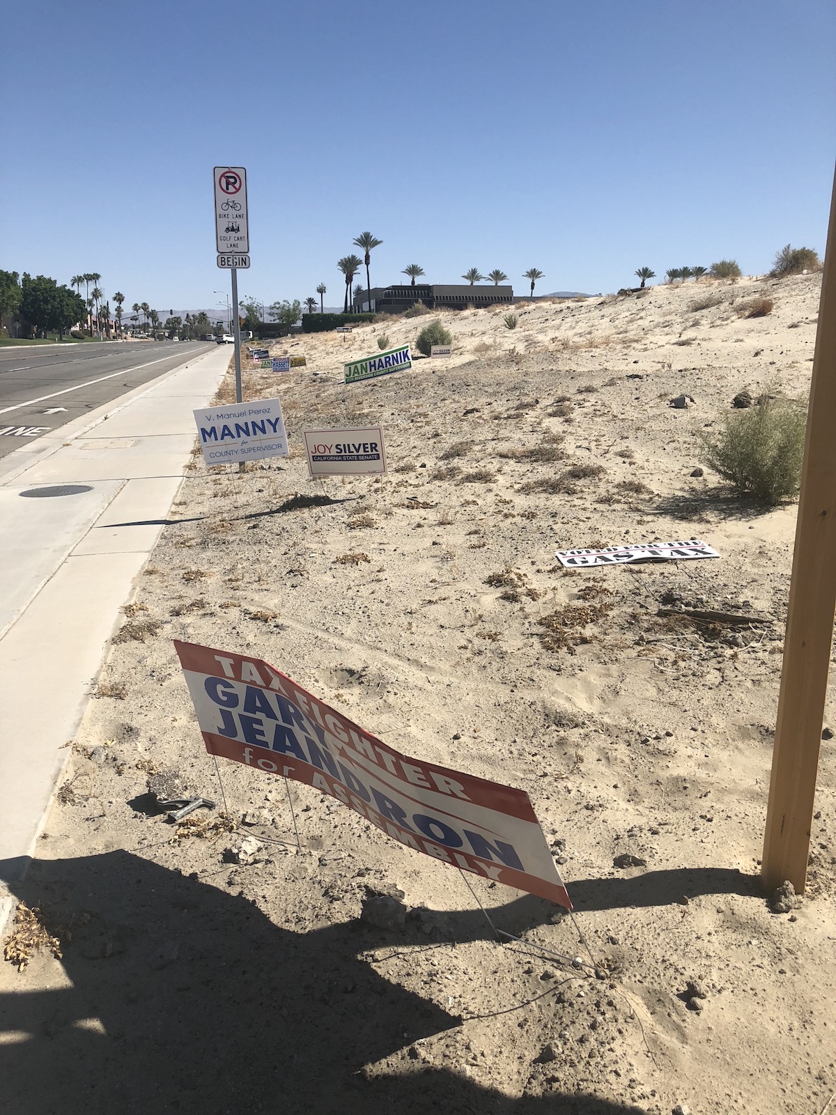 Political campaign signs seen littering Cook Street in Palm Desert, California