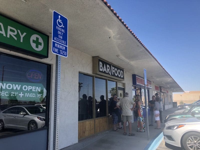 The line forms outside of Paul Bar before it opened at 4 pm in Palm Springs 