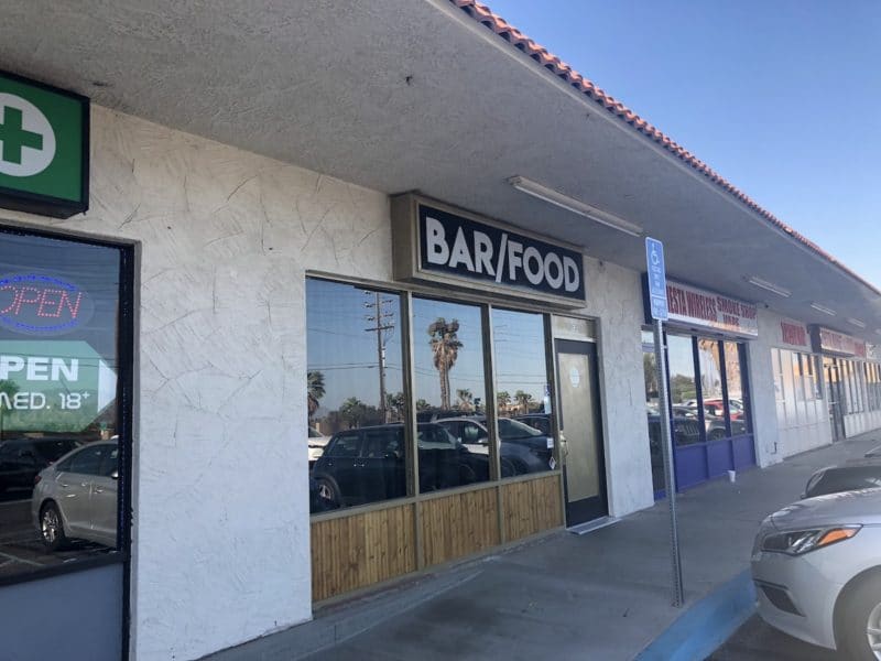 The exterior of Paul Bar - just a sign that reads "Bar/Food" in Palm Springs