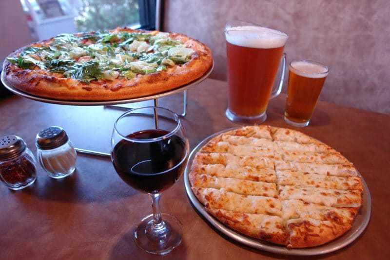 A Club Pizza, cheese bread, wine, and beer at Upper Crust Pizza in Cathedral City, California 