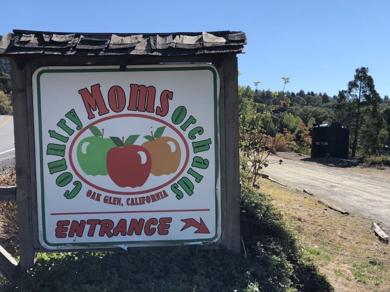 A sign for Moms orchards in Oak Glen California