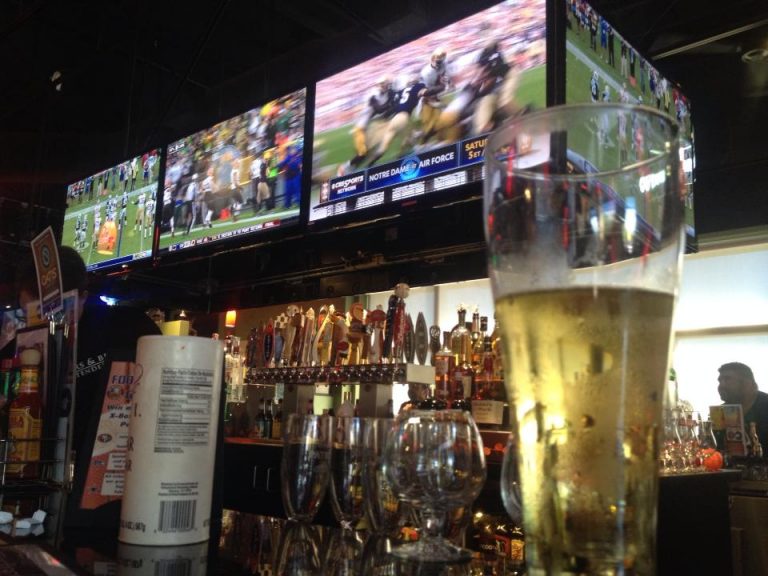 A beer served at the bar during Happy Hour at Burgers and Beer