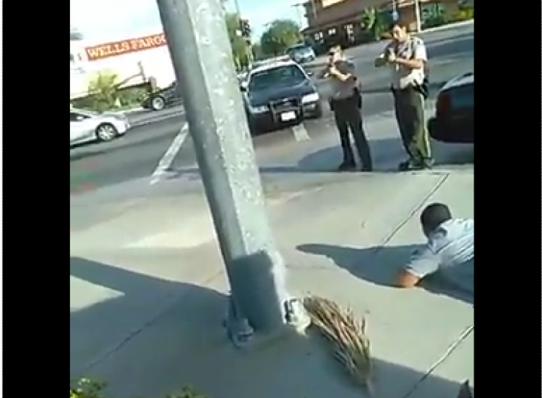 Let’s All Watch a Video of a Cop and a Guy With a Camera Phone Both Completely Overreact