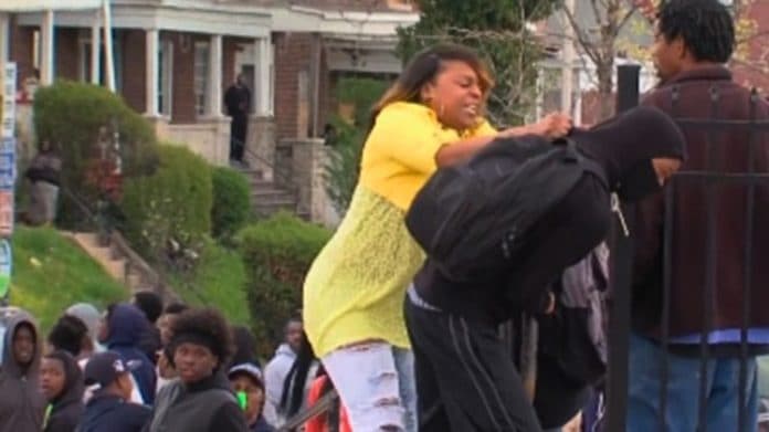 Baltimore mom pulls son out of crowd