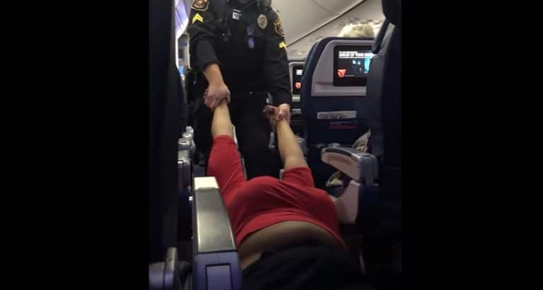 Video: passenger bound for SD dragged off flight because she boarded early