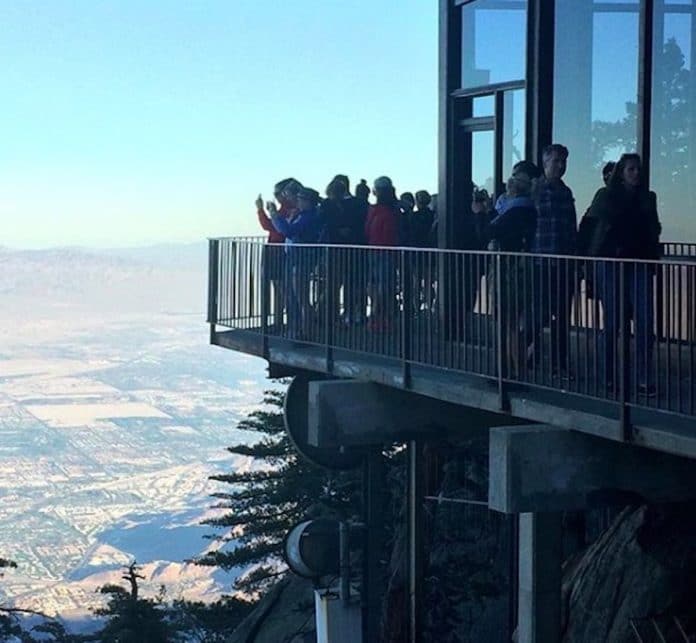 Visitors take pictures from the patio at the Palm Springs Aerial Tramway