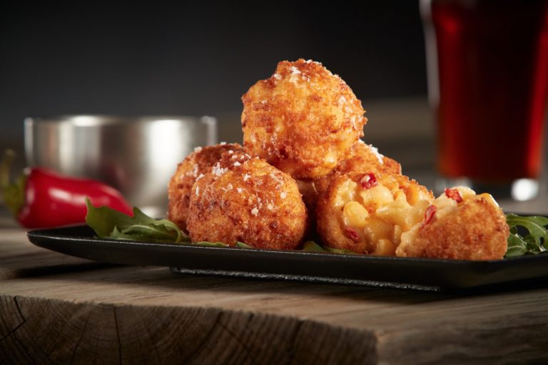 Eureka! has lots of new menu items including Mac N’ Cheese Balls, Bourbon Cake, and a Flat Iron Dip