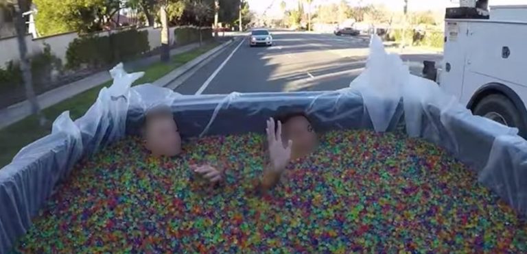 Parents arrested after driving around two kids in truck bed full of Orbeez, posting on YouTube