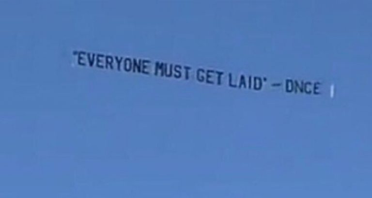 This banner flying above Coachella has a point