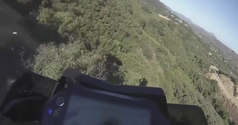 [WATCH] Motorcyclist plunges down 250 foot cliff and survives!