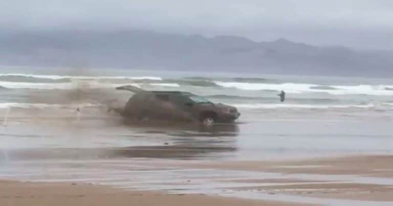 California driver learns spinning tires in wet sand doesn’t help