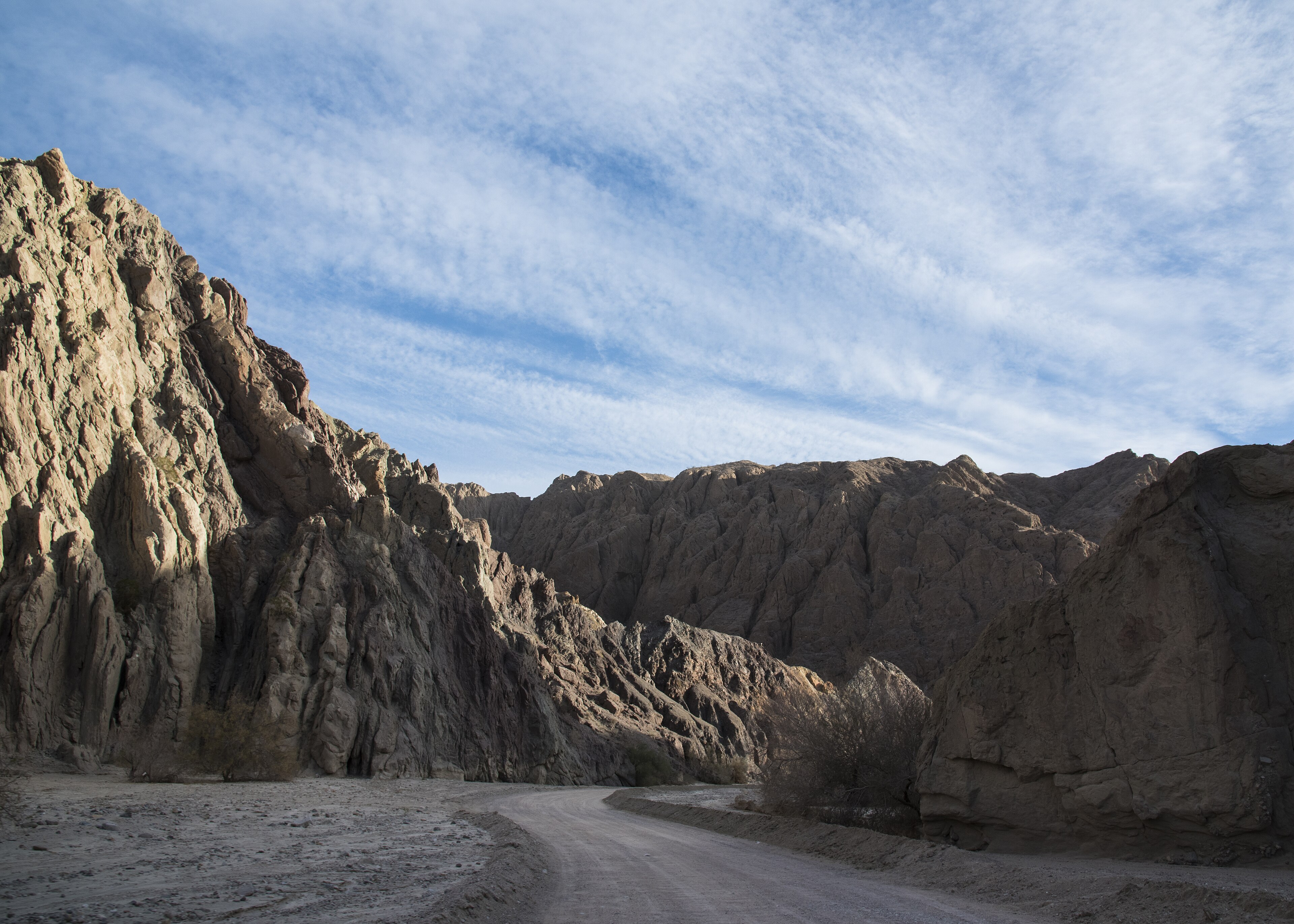 Hikers approaching the entrance to Ladder Canyon in the Mecca Hills near Painted Canyon